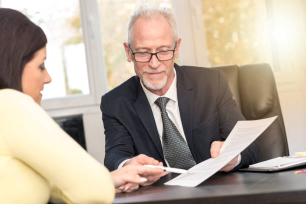istock Woman meeting financial adviser in office, light effect 906045850