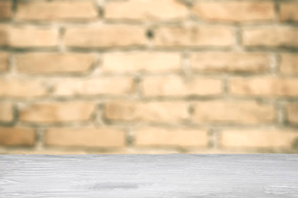 istock Rustic wood for display and montage product and brick wall as background 906047960