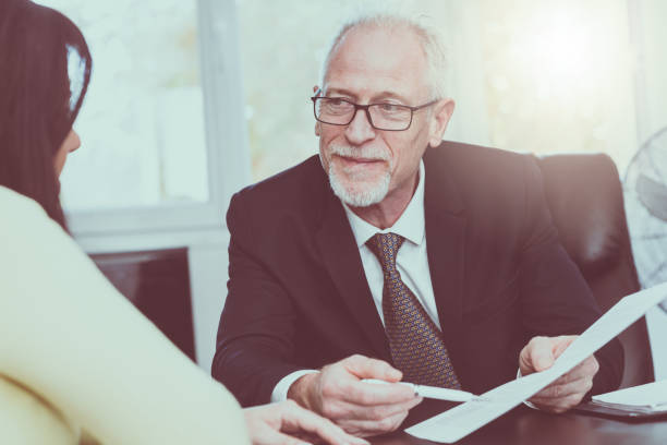 istock Woman meeting financial adviser in office, light effect 906056170