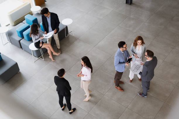 istock Group of business people collaborating and working on project 906059702