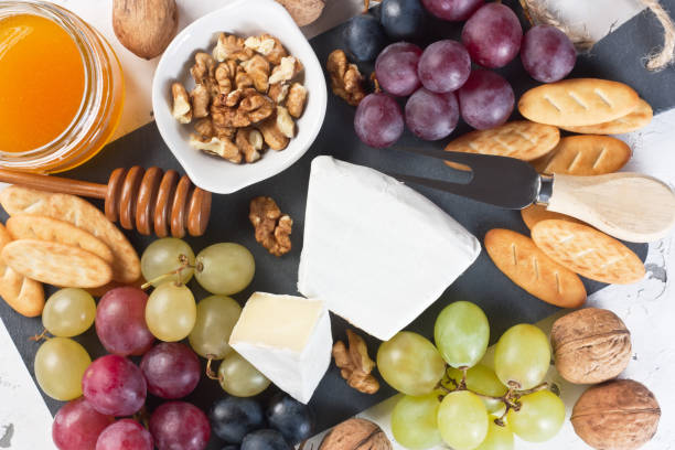 Cheese plate with Brie delicatessen dessert stock photo