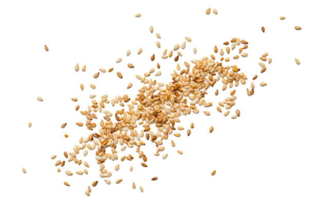 Sesame seeds Sesame seeds on white background sesame stock pictures, royalty-free photos & images