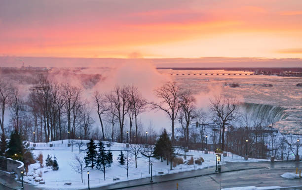 Niagara Horseshoe Falls with fresh snow and sunrise clouds in winter morning
