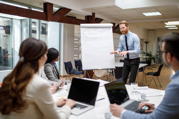 istock Businessman presenting new project to partners in the office 906118976
