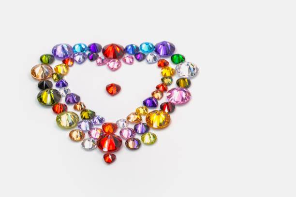 Colorful polished gemstones in heart shape on white background. heart of love design with colorful gemstone for valentine day
