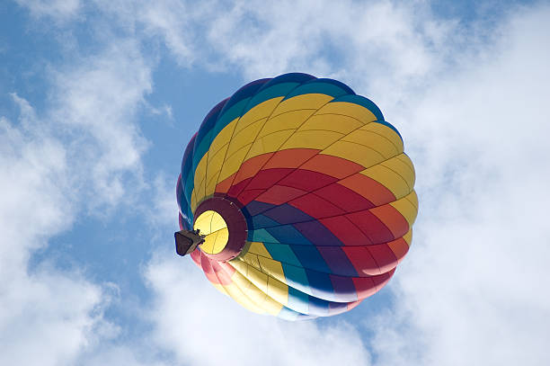 istock Colorful Hot Air Balloon Amidst clouds 90614336