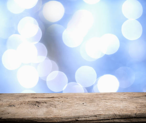 istock Wood table top on blue bokeh abstract background - can be used for montage or display your products.Vintage color 906143430