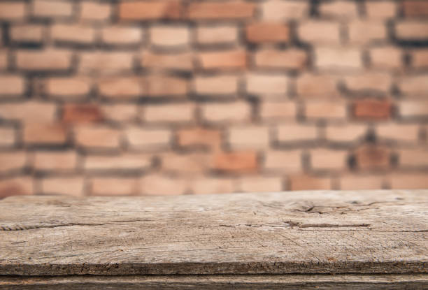 istock Rustic wood for display and montage product and brick wall as background 906143842