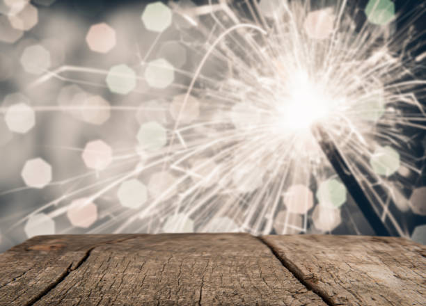 istock Empty rustic wood good for montage or display product for holidays with sparkler in background 906146572