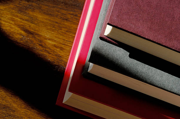 istock Back to school, stack of hardback books in natural light 90614720