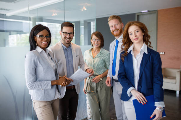 istock Group portrait of successful office team at work 906147256