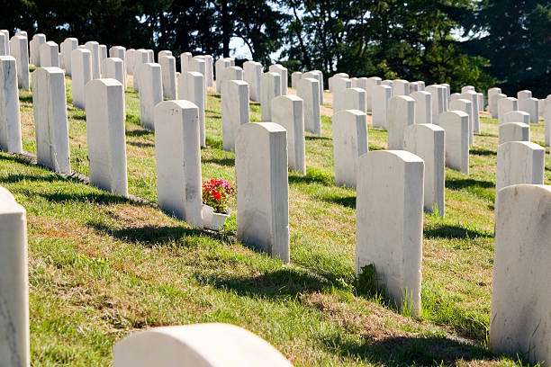 istock Soldiers gravesite with flowers - cemetary 90615075
