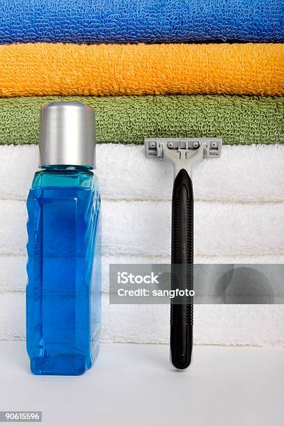 Aftershave And Razor Stock Photo - Download Image Now - Aftershave, Blue, Bottle