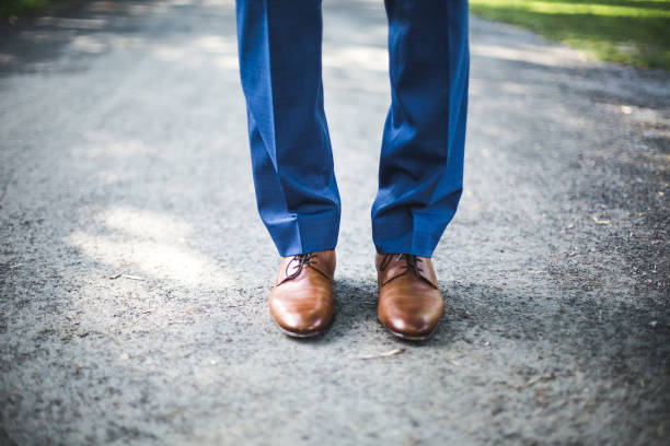 istock Man's Pant Legs and Shoes 906174780