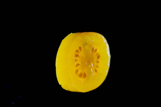 Tomato slice and smoke photographed in front of a plug-in flash in the studio
