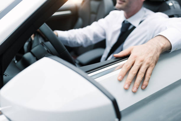 istock Businessman driving his car 906193500