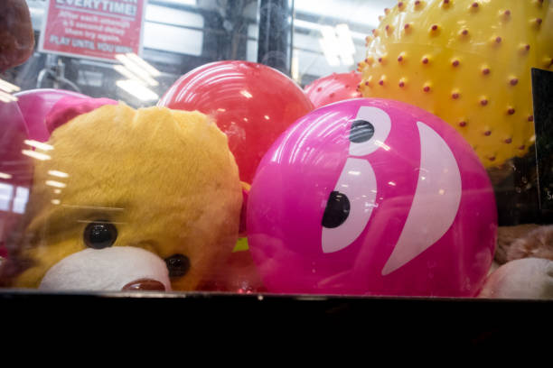 istock Prizes and claw in claw machine game 906193588