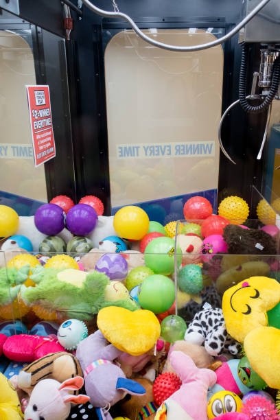 istock Prizes and claw in claw machine game 906193598