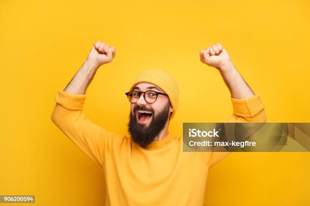 Man In Yellow Clothes Feeling Happy Stock Photo - Download Image Now - Men, Yellow Background, Yellow