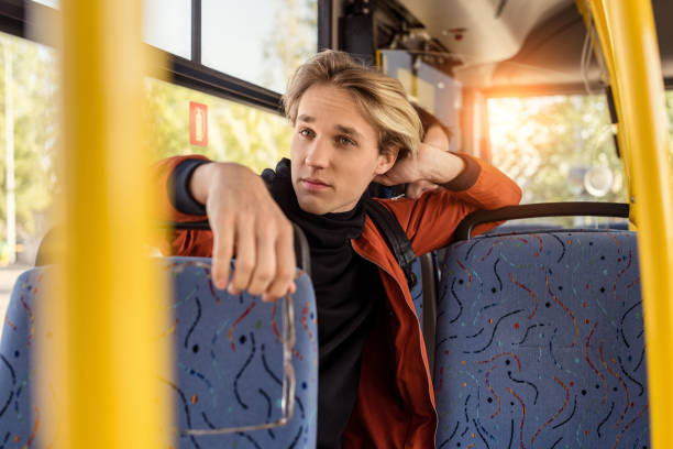 istock man riding in public transport 906200894