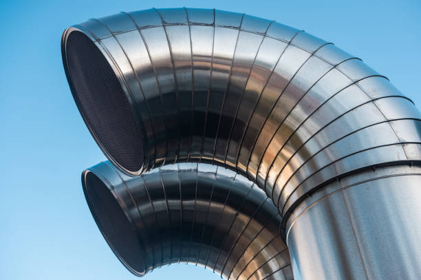 istock Funnel ventilation ducts on a modern building,  blue sky 906201198