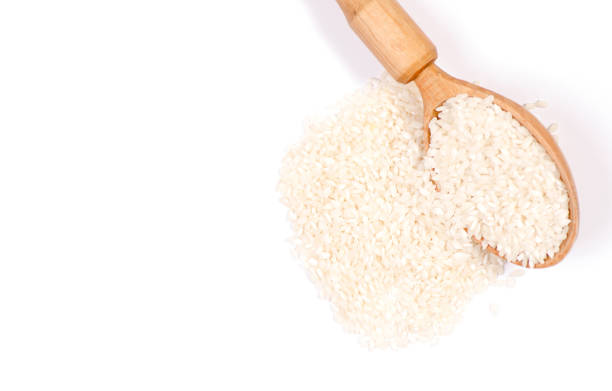 istock A rice cereals wooden spoon on a white background 906203278