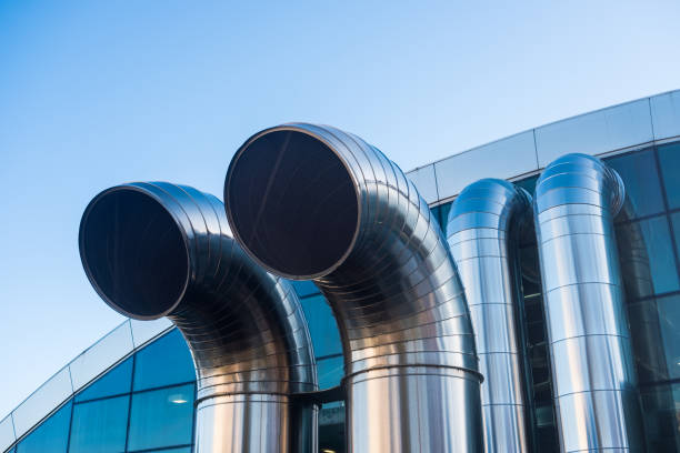 istock Funnel ventilation ducts on a modern building,  blue sky 906203848