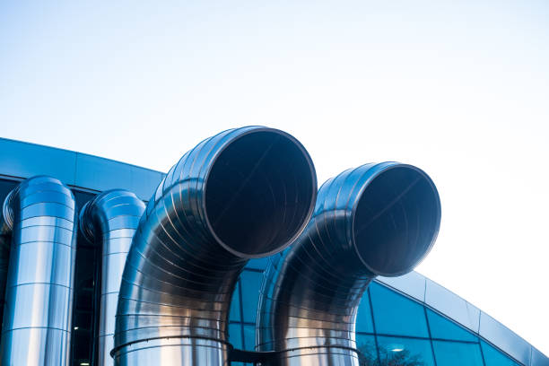 istock Funnel ventilation ducts on a modern building,  blue sky 906204282