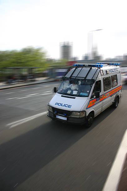 Police van traveling at speed along the highway stock photo