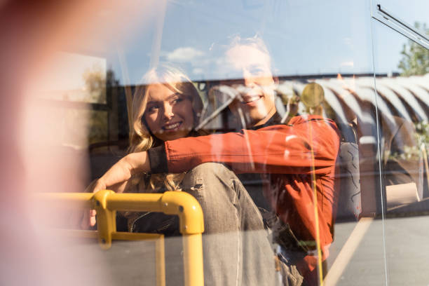 istock smiling couple in public transport 906262752