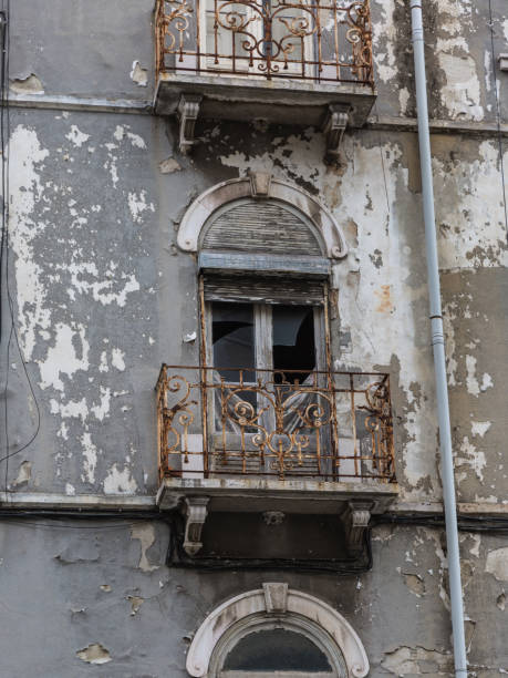 istock Typical Antique Portuguese Architecture: Grey Facade with Old Windows - Portugal 906271008
