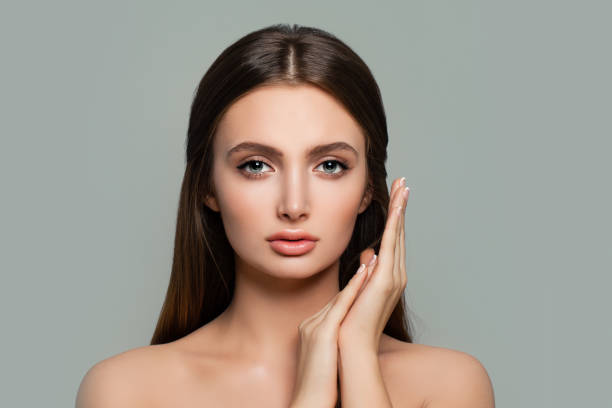 istock Cute Woman Spa Model. Beautiful Female Face on Background with Copy space 906275162