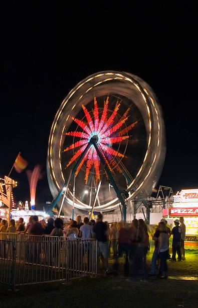 istock Waiting in Line with Ferris Wheel Motion Blur 90627767