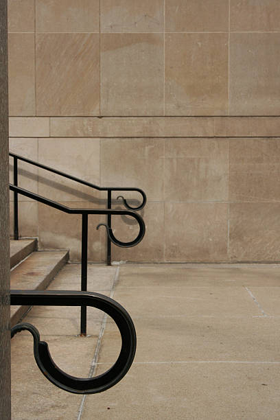 Reoccurring Black Iron Handrails Contrast Limestone Walls 02 stock photo