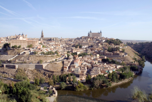 Toledo Cityscape with the Alcazar fortress and the Tagus River, Spain. Composite photo