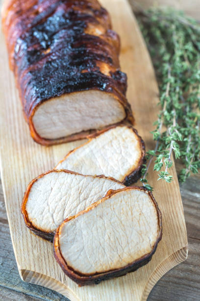 istock Pork loin wrapped in bacon 906320934