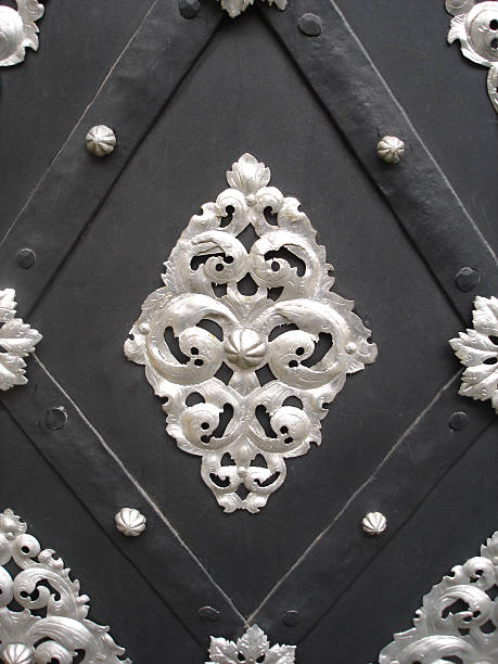 silver decoration on an old metal door - fsachs78 stockfoto's en -beelden