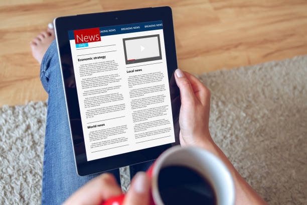 istock Woman reading news on tablet 906343660