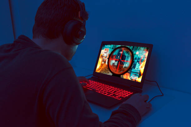 istock Action video game plays out on gaming laptop at night 906345794