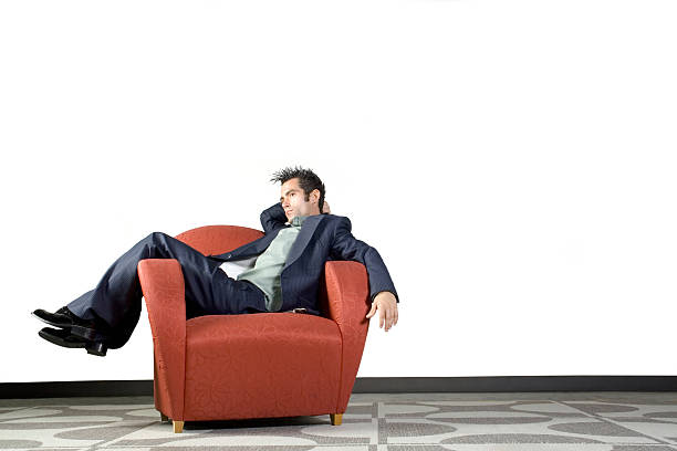 istock Stylish Businessman in Red Chair 90635146
