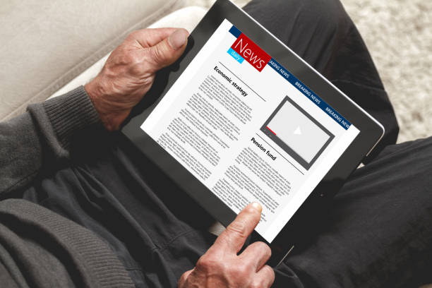istock Senior holding a tablet in hands 906352164