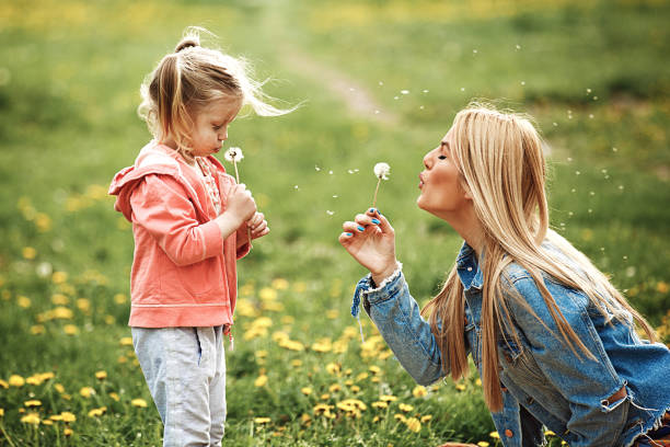 istock Mother and daughter in the park 906354520