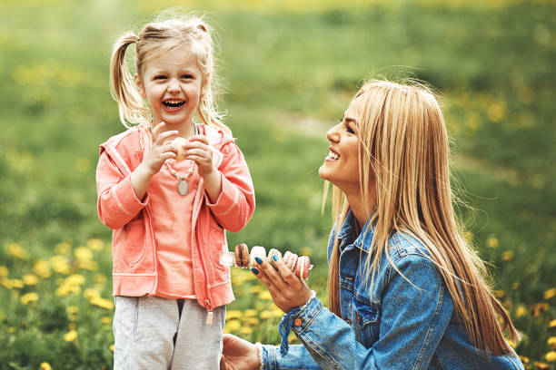 istock Mother and daughter in the park 906354546