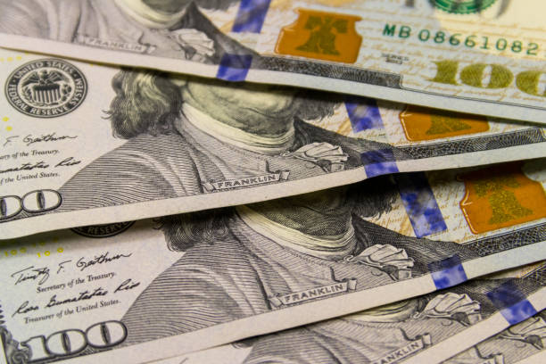 istock Background of one hundred dollar bills 906357726