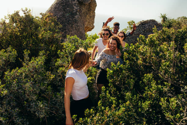 istock Group of friends walking through a mountain trail 906360328