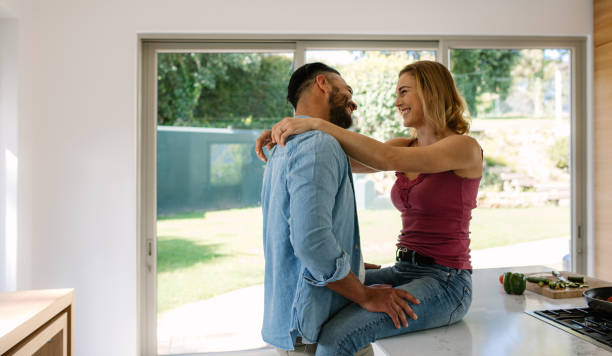 istock Couple sharing a romantic moment in kitchen 906360592