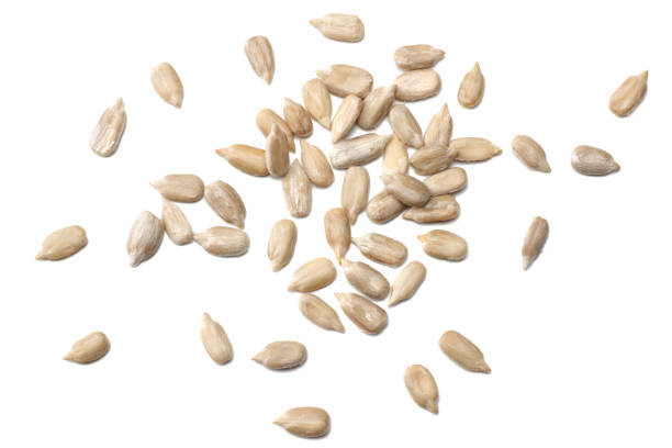 istock Sunflower seeds isolated on white background top view 906360756