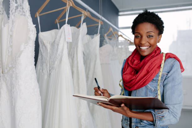 istock Wedding dress designer working in her boutique 906365468