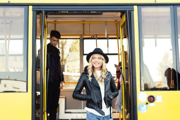 istock woman walking out city bus 906369194