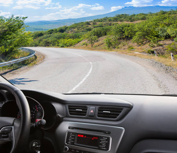 istock car going on the mountain road 906371498